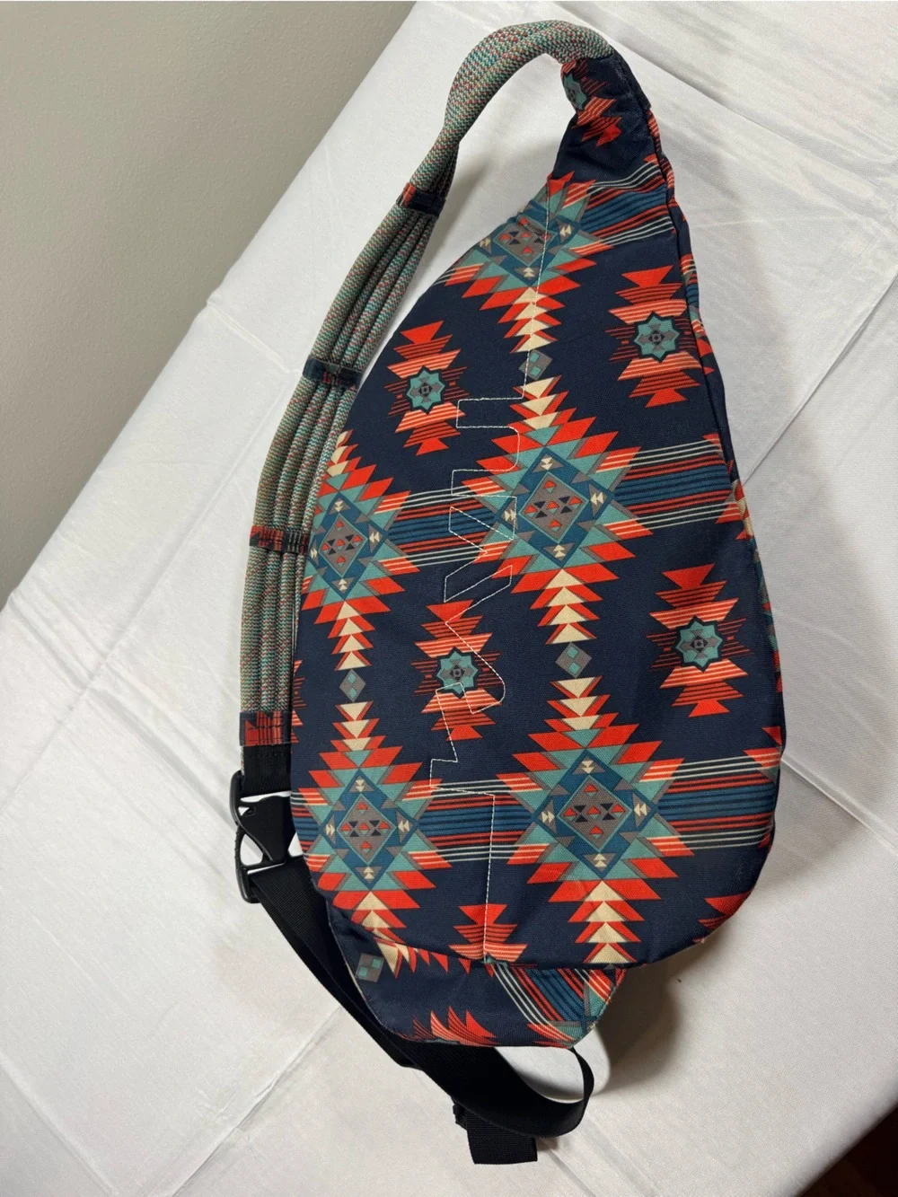 Kavu Rope Sling Bag in Navy with Red & Teal Pattern